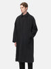 Model standing in studio wearing the A.PRESSE Maxi Length Washed Silk Balmacaan Coat in Black buttoned up