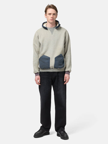 Model standing in studio wearing the   A.PRESSE Vintage Attached Hood Sweat Parka in Oatmeal