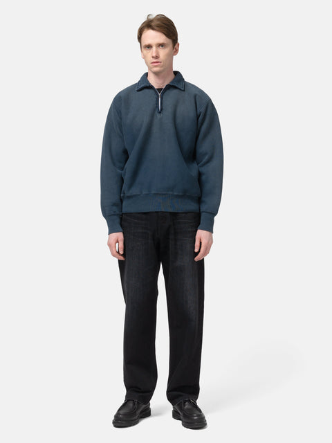 Model standing in studio wearing the A.PRESSE Vintage Half Zip Sweatshirt in Blue