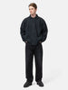 Model standing in studio wearing the A.PRESSE Vintage Sweat Cardigan in Black