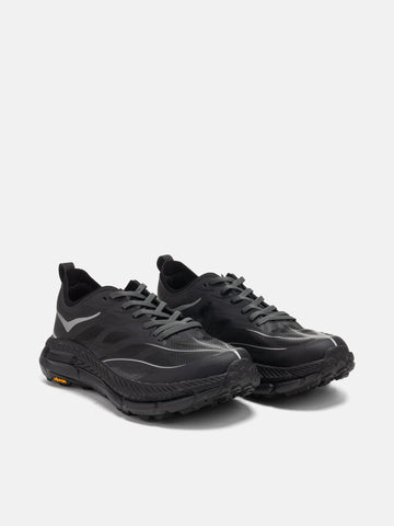 three quarter view of the HOKA U Mafate Speed 4 Lite Black / Outer Orbit