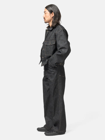 Side view of the model wearing the LEMAIRE Wide Pants With Studs Slate