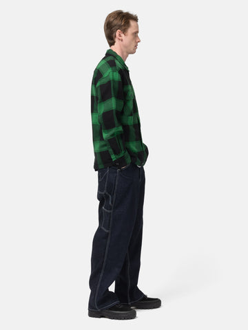side view of model wearing NEIGHBORHOOD Denim Painter Pants Indigo