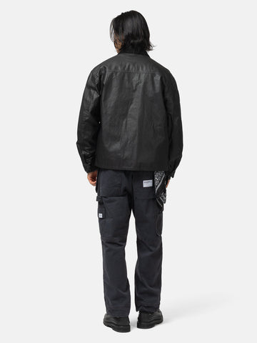 Back shot of the model wearing the Neighborhood Coated Field Jacket Black