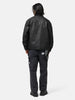 Back shot of the model wearing the Neighborhood Coated Field Jacket Black