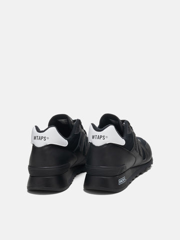 Back shot of the New Balance x WTAPS MiUSA 1300 Black