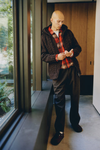 Model is wearing Pacific Handknit Hooded Parka in charcoal