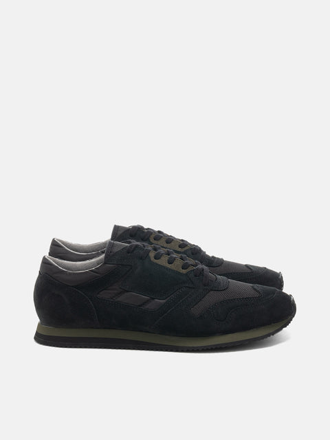 Side view of the Reproduction of Found British Military Trainer in Black premium suede and nylon photographed in studio.