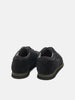 Rear view of the Reproduction of Found British Military Trainer in Black premium suede and nylon photographed in studio.