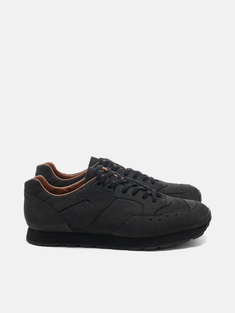 Side  view of the Reproduction of Found French Military Trainer in black nubuck leather photographed in studio.