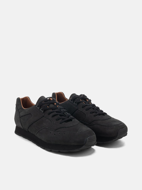 Three quarter view of the Reproduction of Found French Military Trainer in black nubuck leather photographed in studio.