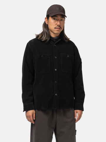 Half body shot of the model wearing the Stone Island Cotton corduroy overshirt Black