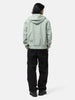 Back shot of the model wearing the Stone Island Light Soft Shell-R_E.Dye® Technology Hooded Jacket Sage