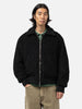 Close up shot of the model in studio wearing the wool boa zip-up blouson from URU.