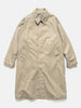 Flat shot of the UNLIKELY Balmacaan Coat in Beige