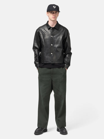 model standing in the studio wearing the  ULIKELY Skater's Work Pants in Green
