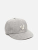 Shot in studio of the UNLIKELY Team Cap in Gray
