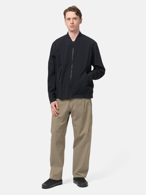 Full body shot of the model wearing the Veilance Spere Cargo Pant Lt Gnosis