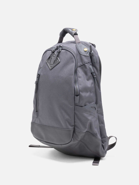 Studio shot of the Visvim Cordura 20L backpack in charcoal.
