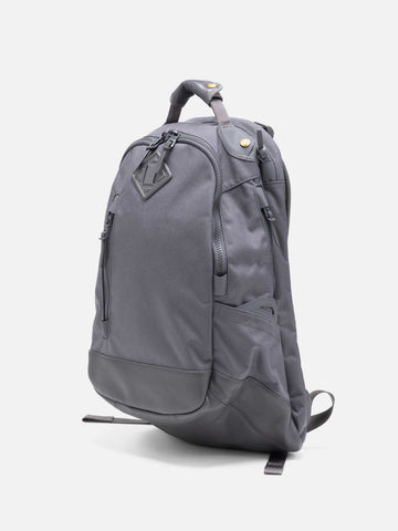 Studio shot of the Visvim Cordura 20L backpack in charcoal.