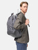 Model wearing the Visvim Cordura 20L backpack in charcoal on the shoulder.