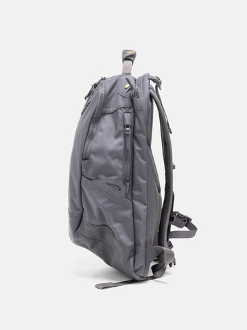Side view of the Visvim Cordura 20L backpack in charcoal.