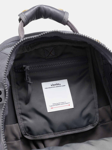 Detail view of the interior of the Visvim Cordura 20L backpack in charcoal.
