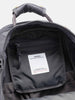 Detail view of the interior of the Visvim Cordura 20L backpack in charcoal.
