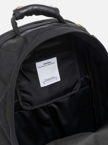 Detail view of the interior of the Visvim Cordura 22L backpack in black