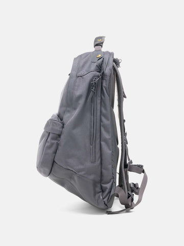 Side view of the Visvim Cordura 22L backpack in Charcoal