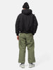 Rear view of the Model standing in studio wearing the WTAPS MILT9601  Trousers NYCO Weather in Olive Drab