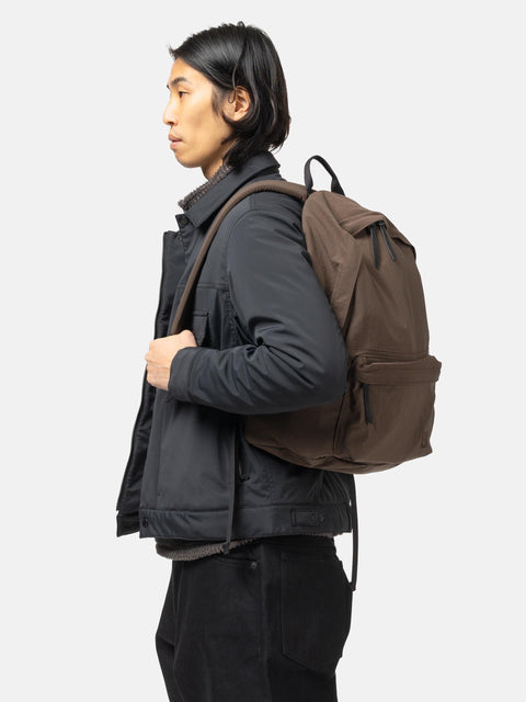 Model is wearing the HOBO Backpack 22L Nylon Oxford Onibegie Dyed Brown
