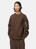 half-body view of the model wearing the sacai Sponge Sweat Pullover Brown