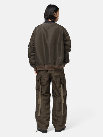 rear view of the model wearing the sacai Sponge Sweat Pullover Navy x Khaki
