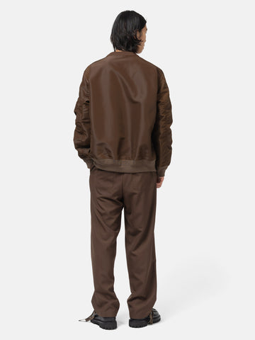 rear view of the model wearing the sacai Suiting Pants Brown
