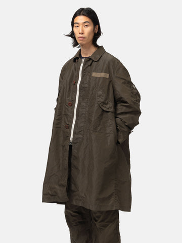 half-body view of the model wearing the sacai Treated Nylon Twill Coat Khaki